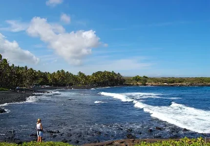 Black sand shoreline, surf and greenery at Punaluʻu Beach